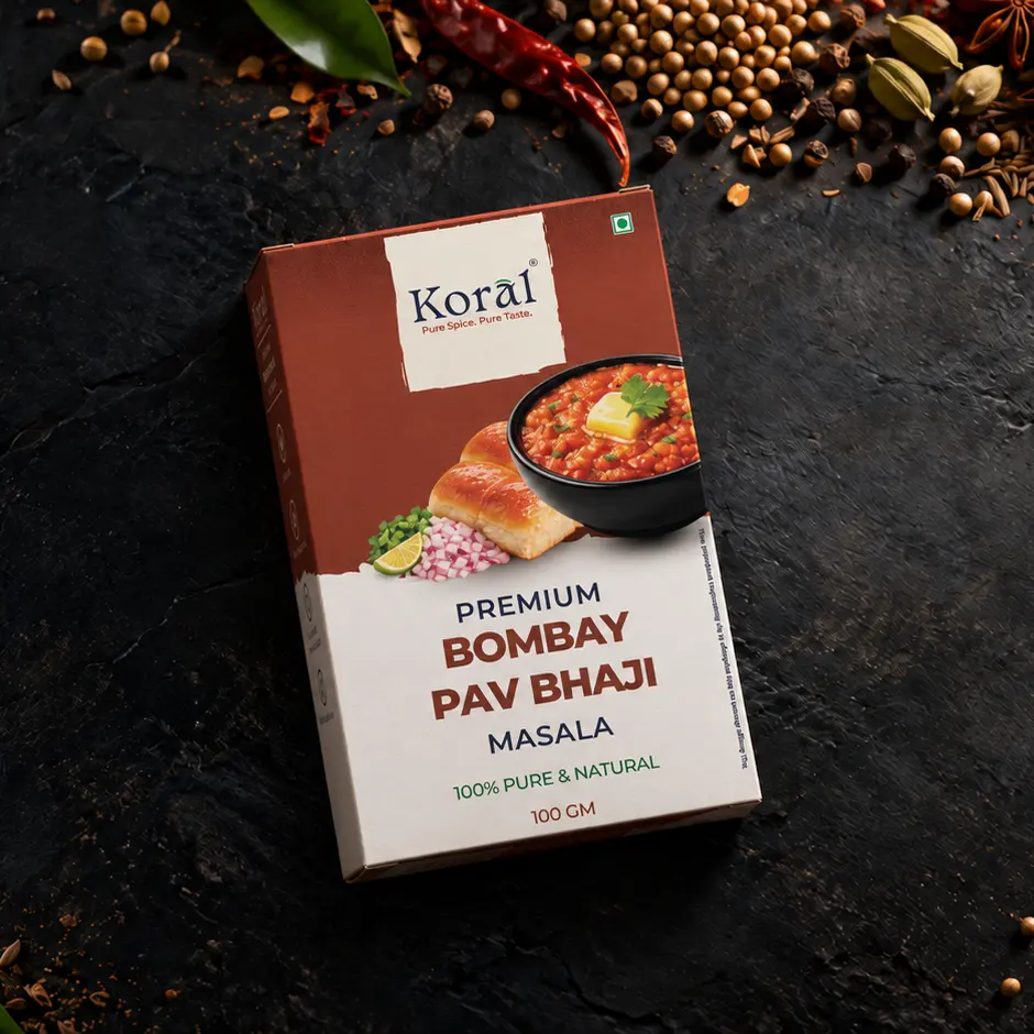 The Bombay Pav Bhaji Masala box lying on dark slate among whole spices